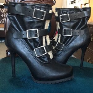 Ankle length high heeled boots